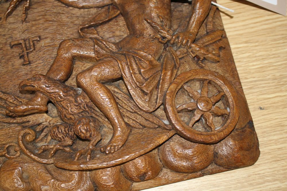 A 19th century Continental relief carved oak plaque depicting Jupiter riding in a chariot pulled by eagles, 25 x 34cm